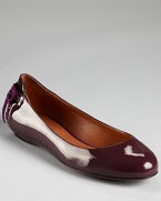 A corset-inspired, grosgrain laceup lends a feminine finish to Vera Wang Lavender Label's Helen flats.
