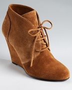 An almond toe lends a delicate touch to Via Spiga's Sophie booties--a laceup vamp gives a laid-back look.