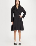 A refined, feminine take on the classic trench, tailored with a full-skirted silhouette.Foldover collar with hook-and-eye closuresDouble-breasted button frontBodice pleatsLong sleevesFull skirtAbout 39 from shoulder to hem65% polyester/35% woolDry cleanImportedModel shown is 5'11 (180cm) wearing US size Small. 