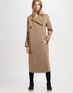Modernized by an asymmetrical zipper, this military-inspired trenchcoat has notched lapels, slash pockets and a back vent for mobility. Notched lapelsButton frontAsymmetrical zipperLong sleeves with buttoned cuffsSlash pocketsButtoned back belt; back ventAbout 36 from shoulder to hemCottonDry cleanMade in ItalyModel shown is 5'10 (177cm) wearing US size 2.