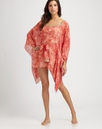 With delicate embroidery, this light-as-air silk coverup is short and definitely sweet.V-neckSelf-tieSilkDry cleanImported