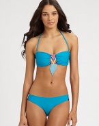 Bohemian beads add exotic charm to this stretch swim design with a convenient, removable halter strap. Removable halter strap ties at neckBandeau topBack clasp closureStretch bottom features beaded sidesFully lined80% nylon/20% spandexHand washImported
