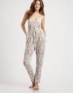 The quintessential balance of comfort and style, this stretch modal jumpsuit is a must-have swim coverup. Braided strapsFaux wrap frontFront pocketsAllover printDrawstring waist92% modal/8% spandexDry cleanMade in USA