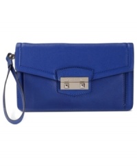Always keep your cash and cards at your fingertips with Cole Haan's wristlet that goes from a wallet to a clutch in just one click. Crafted from rich leather and accented with a signature golden lock, it's the ideal everyday accessory.