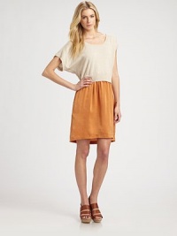 Wool-blend scoopneck with short dolman sleeves has an attached silk skirt with slash pockets and a hi-low hem. Ribbed scoopneckDropped shouldersShort dolman sleevesAttached silk skirt with slash pocketsHi-low hemAbout 22 from natural waist35% wool/32% nylon/30% viscose/3% cashmereDry cleanMade in USA of imported fabricModel shown is 5'10 (177cm) wearing US size Small.