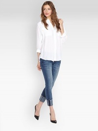 Exaggerated hi-low hem and front flap pockets update this semi-sheer silk basic.Point collar Button front Two flap chest pockets Long sleeves with button cuffs Back yoke and box pleat Shirttail hem About 27 from shoulder to hem Silk Dry clean Imported Exaggerated hi-low hem and front flap pockets update this semi-sheer silk basic.Point collar Button front Two flap chest pockets Long sleeves with button cuffs Back yoke and box pleat Shirttail hem About 27 from shoulder to hem Silk Dry clean Imported