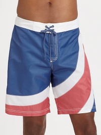 A summer favorite, for the beach and beyond, brightly designed in quick-drying nylon for maximum comfort and support.Drawstring tie waistBack flap pocketInseam, about 9NylonMachine washImported A summer favorite, for the beach and beyond, brightly designed in quick-drying nylon for maximum comfort and support.Drawstring tie waistBack flap pocketInseam, about 9NylonMachine washImported