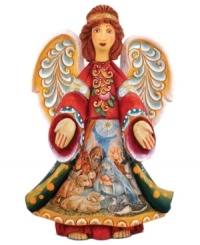 A spiritual nativity scene is hand painted upon the robe of this ornately crafted angel ornament from DeBrekht for a lovely reminder of the true miracle of Christmas. A spiritual nativity scene is hand painted upon the robe of this ornately crafted angel ornament from DeBrekht for a lovely reminder of the true miracle of Christmas.