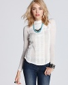 An homage to Victorian elegance, this Free People top features lovable lace detailing in pure white.