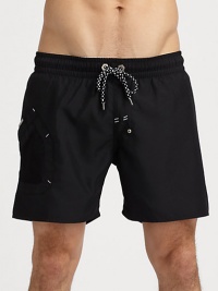 Classic swim trunk style, in a rich solid, finished with side pocket and signature logo detail.Drawstring elastic waistFully linedInseam, about 7PolyesterMachine washImported Classic swim trunk style, in a rich solid, finished with side pocket and signature logo detail.Drawstring elastic waistFully linedInseam, about 7PolyesterMachine washImported