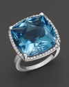 A cushion cut blue topaz is framed by diamonds in this sparkling 18K white gold ring from Lisa Nik's Rocks Collection.