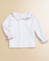 A shirt almost as precious as baby with a classic Peter Pan collar, picot trim and heart appliqué.Peter Pan collarLong sleevesBack buttonsCottonMachine washImported