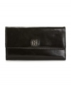 A sleek wallet to hold your checkbook and more, by Giani Bernini.