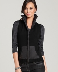 Give your style a sense of adventure in this Eileen Fisher merino vest, touting a two-tone silhouette and generous funnel neckline for utilitarian-chic look. Give your style a sense of adventure in this Eileen Fisher merino vest, touting a two-tone silhouette and generous funnel neckline for utilitarian-chic look.