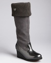 A cozy rib knit trims the opening of KORS Michael Kors' Pavia boots, a tall style equipped with a wedge heel.