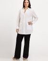 A crisp stretch cotton design with a beloved relaxed fit and feminine, curved hem. Collar neckLong sleevesButton frontPatch pocketsCurved hemBack yoke and back pleatAbout 33 from shoulder to hem72% cotton/23% polyamide/5% Lycra®Machine washImported of Italian fabric
