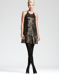 Alluring metallics illuminate an intricate lace silhouette for a simply stunning DKNY dress. Showcase the ruffled hemline against sheer black tights and ignite the night. Alluring metallics illuminate an intricate lace silhouette for a simply stunning DKNY dress. Showcase the ruffled hemline against sheer black tights and ignite the night.