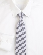 Narrow stripes lend an elegant appeal to this beautifully woven Italian silk tie. About 3 wideSilkDry cleanMade in Italy