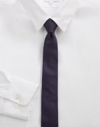 A simplistic design woven in smooth Italian silk.About 2 wideSilkDry cleanMade in Italy