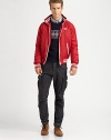 A contemporary interpretation of a classic varsity jacket is crafted from sleek, resilient nylon with contrast piping and chest logo detail.Zip frontStand collarWaist zip pocketsBanded cuffs and hemFully linedAbout 26 from shoulder to hemPolyesterMachine washImportedOUR FIT MODEL RECOMMENDS ordering true size. 