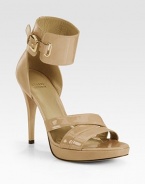 Held in place by a wide, adjustable ankle strap, this patent leather classic has criss-cross straps and an ultra-skinny heel. Self-covered heel, 3½ (90mm)Covered platform, 1 (25mm)Compares to a 2½ heel (65mm)Patent leather upperLeather lining and solePadded insoleImportedOUR FIT MODEL RECOMMENDS ordering true size. 