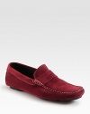 Soft suede penny loafer with intricate contrast stitching and a convenient rubber sole. Suede upperLeather liningPadded insoleSuede and rubber soleMade in Italy