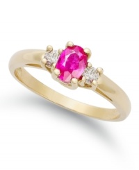 Pretty and petite. This beautiful three-stone ring features an oval-cut ruby (1/2 ct. t.w.) with two round-cut diamonds at the sides (1/8 ct. t.w.). Set in 14k gold.