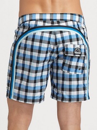 Quick-drying swim trunks, in a vivid check print, are accented by a lace-up waist and signature rainbow detail across the back and down the leg.Drawstring waistRear flap pocketInseam, about 7NylonMachine washImported