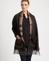 Reverses from solid to a bold check pattern with fringe trim on luxurious cashmere.Cashmere74 X 15Dry cleanImported