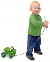 Boundless fun will accompany your toddler with this friendly wooden froggy pull toy. When pulled by its string, it playfully hops up and down with wiggling eyes, which adds to the excitement of those early steps.