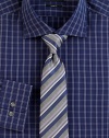 An elegant mix of stripes sharpen a classic silk tie woven in Italy. About 3 wideSilkDry cleanMade in Italy