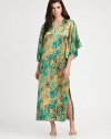 Lush florals brighten this silky-smooth design with wide, billowy sleeves. V-neckDropped shouldersThree-quarter length wide bell sleevesSide slits at hemAbout 53 from shoulder to hemPolyesterMachine washImported