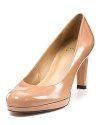 Patent leather platform pumps from Stuart Weitzman, an everyday shoe for the working girl.