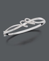 Let ribbons of silver and diamond unfurl at your wrist. This elegant bracelet features swirling sterling silver loops with channel-set and round-cut diamonds at the center. Approximate diameter: 2-3/4 inches. Let ribbons of silver and diamond unfurl at your wrist. This elegant bracelet features swirling sterling silver loops with channel-set and round-cut diamonds at the center. Approximate diameter: 2-3/4 inches.