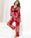 So smooth and colorful. This pajama set by Style&co features a top with velour at the neckline, under the bust and cuffs and roomy pants with a comfy elastic waistband.