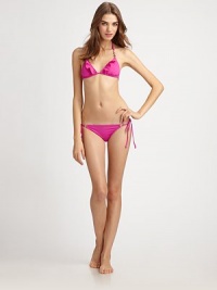 A classic swim design featuring sexy side ties complemented by delicate metallic rings. Stretch comfortSide tiesFully lined80% nylon/20% spandexHand washMade in USA of imported fabricPlease note: Bikini top sold separately. A classic swim design featuring sexy side ties complemented by delicate metallic rings. Stretch comfortSide tiesFully lined80% nylon/20% spandexHand washMade in USA of imported fabricPlease note: Bikini top sold separately.
