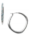 Get your diva on in Fossil's Glitz hoop earrings. Sparkling blue and clear crystals adorn a silver tone mixed metal setting for conversation-sparking style. Approximate diameter: 1-1/3 inches.