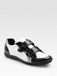Metallic tabs with embossed logos detail this intriguing leather style with patent leather trim. Leather lining Padded insole Rubber sole Imported Metallic tabs with embossed logos detail this intriguing leather style with patent leather trim. Leather lining Padded insole Rubber sole Imported