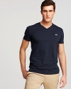 A soft pima cotton tee from Lacoste, with v-neckline and logo at left chest.
