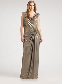 This shimmering, floor-sweeping design features an alluring cowlneck and waist-flattering gathered details, complemented exquisitely by rhinestone beading.CowlneckCap sleevesEmbellishment at gathered waistRuched back detailsBack zipperFully linedAbout 45 from natural waist92% polyester/8% spandexDry cleanImported