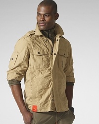 The military-inspired cotton poplin Tenzing jacket features distinctive stitched details and plenty of utility pockets from the sleeve to the hem. The military-inspired cotton poplin Tenzing jacket features distinctive stitched details and plenty of utility pockets from the sleeve to the hem.