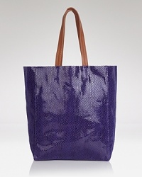While simply styled for daytime practicality, this Sorial tote is a step beyond the tried-and-true, finished in snakeskin-embossed leather. Carry it to make your everyday exotic. While simply styled for daytime practicality, this Sorial tote is a step beyond the tried-and-true, finished in snakeskin-embossed leather. Carry it to make your everyday exotic.