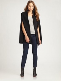 Truly a statement piece, this button-front cape is universally flattering. A hint of cashmere adds luxurious appeal to this design.Faux-leather stand collarButton frontAbout 29 from shoulder to hem70% wool/20% polyamide/10% cashmereDry cleanMade in Italy Model shown is 5'9 (175cm) wearing US size 4. Truly a statement piece, this button-front cape is universally flattering. A hint of cashmere adds luxurious appeal to this design.Faux-leather stand collarButton frontAbout 29 from shoulder to hem70% wool/20% polyamide/10% cashmereDry cleanMade in Italy Model shown is 5'9 (175cm) wearing US size 4.