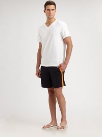 Classic fit swim style in a simple solid with side stripe and logo detail.Drawstring tie waistSide slash pocketsInseam, about 7PolyamideMachine washImported Classic fit swim style in a simple solid with side stripe and logo detail.Drawstring tie waistSide slash pocketsInseam, about 7PolyamideMachine washImported