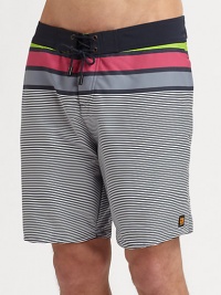 You'll get plenty of beachside attention in this boldly-hued swim design of quick-drying nylon, finished with wide and thin stripes and side logo detail.Drawstring tie waistSide slash pocketsInseam, about 7PolyesterMachine washImported