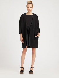Crafted with a voluminous cocoon shape, this nubby knit has slash pockets, three-quarter sleeves and a length that hits below the hips. Button frontThree-quarter sleevesSlash pocketsAbout 34 from shoulder to hem50% polyester/35% alpaca/15% acrylicDry cleanMade in USA of Italian fabricModel shown is 5'10 (177cm) wearing US size 2. Crafted with a voluminous cocoon shape, this nubby knit has slash pockets, three-quarter sleeves and a length that hits below the hips. Button frontThree-quarter sleevesSlash pocketsAbout 34 from shoulder to hem50% polyester/35% alpaca/15% acrylicDry cleanMade in USA of Italian fabricModel shown is 5'10 (177cm) wearing US size 2.