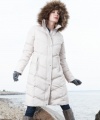 Calvin Klein's knee-length puffer coat features a down-blend fill for heavyweight warmth, while a faux-fur-trimmed hood adds a luxe touch.