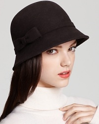 Done up in solid black or brown, this August Accessories cloche is a sophisticated piece for cold weather. Done up in solid black or brown, this August Accessories cloche is a sophisticated piece for cold weather.
