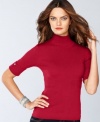 This easy petite turtleneck from INC features a great fit, thanks to ribbed knit and rhinestone details at the sleeves for a flash of sparkle.