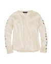 A delicate arrangement of beaded flowers adorns the sleeves of this adorable cotton jersey tee.
